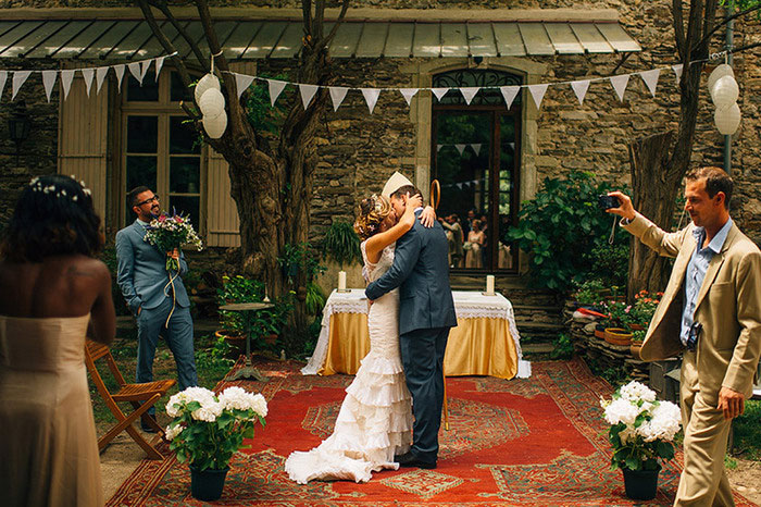 bride and groom first kiss