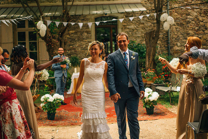 bride and groom walking up aisle