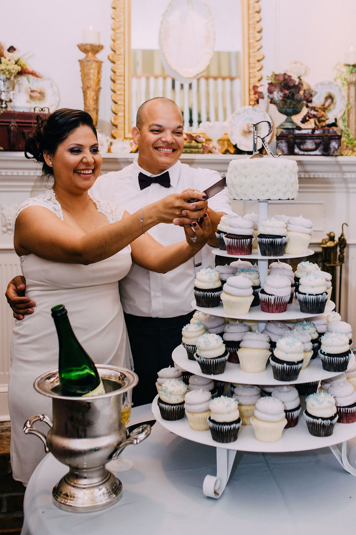 bride and groom cutting cake