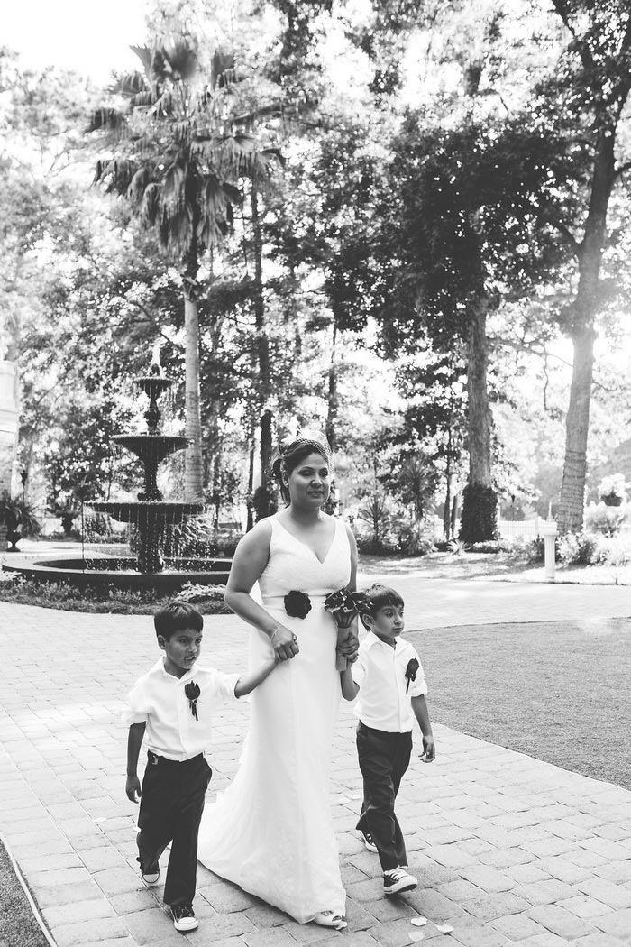 bride walking down aisle with sons