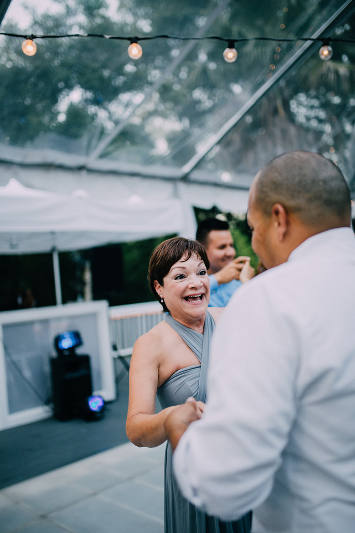 groom dancing with mother