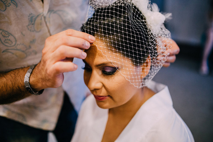 bride having her veil put on