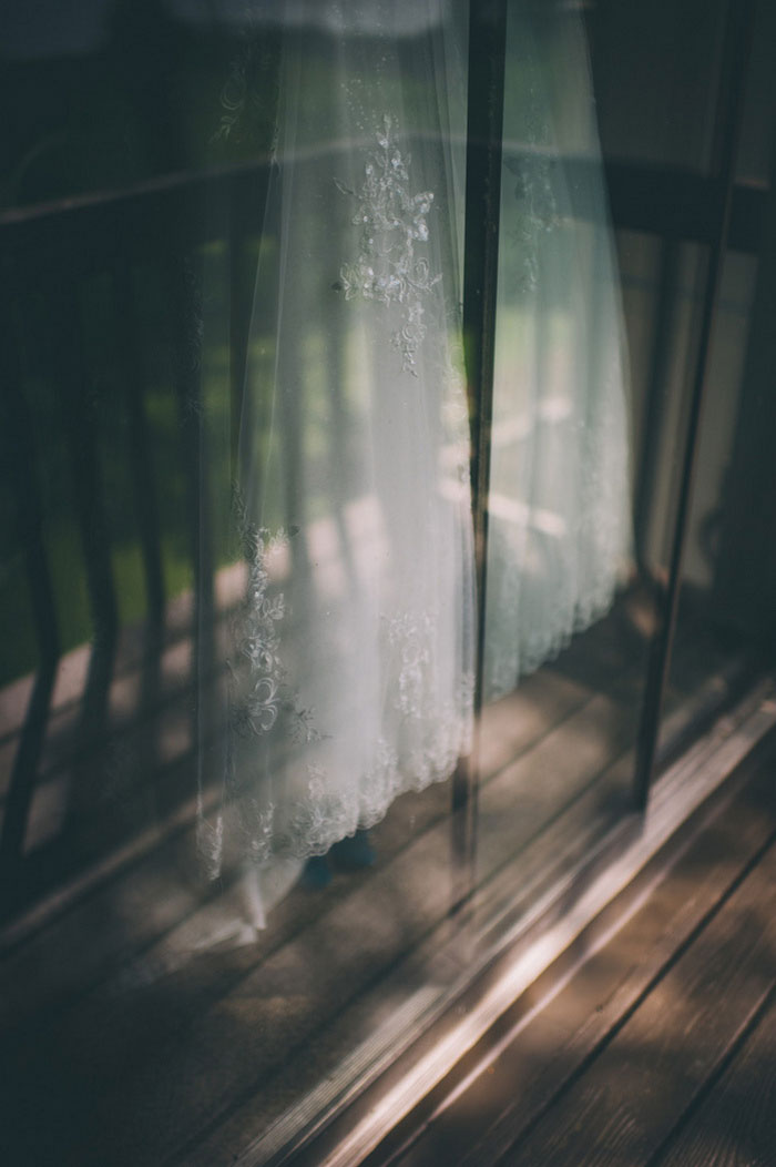 dress hanging against sliding glass door