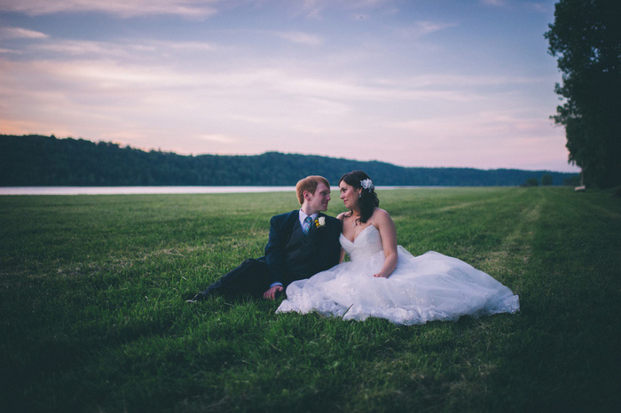 bride and groom portrait in the grass