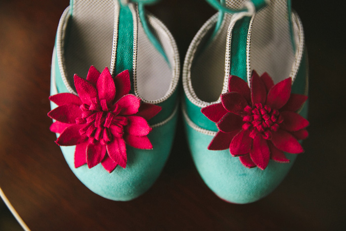 bride's teal shoes with fuchsia flowers