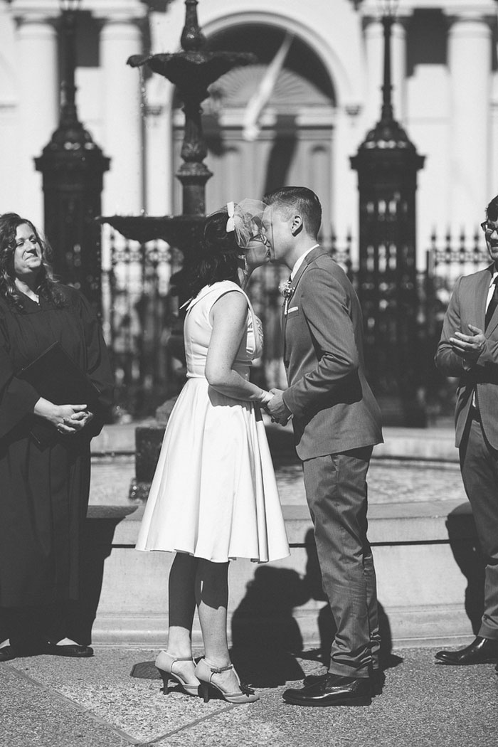 bride and groom first kiss