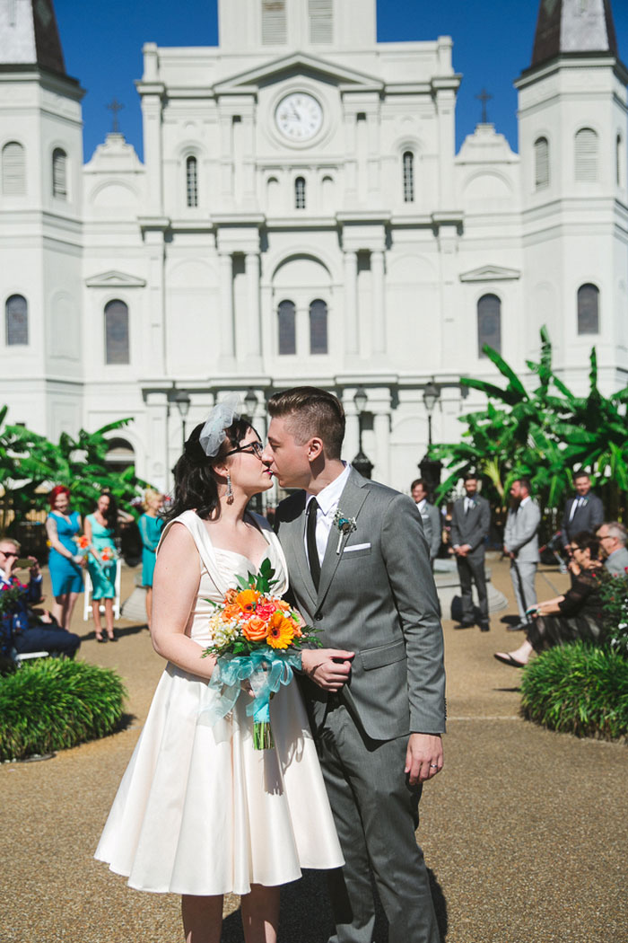 bride and groom kissing in Jackson Square