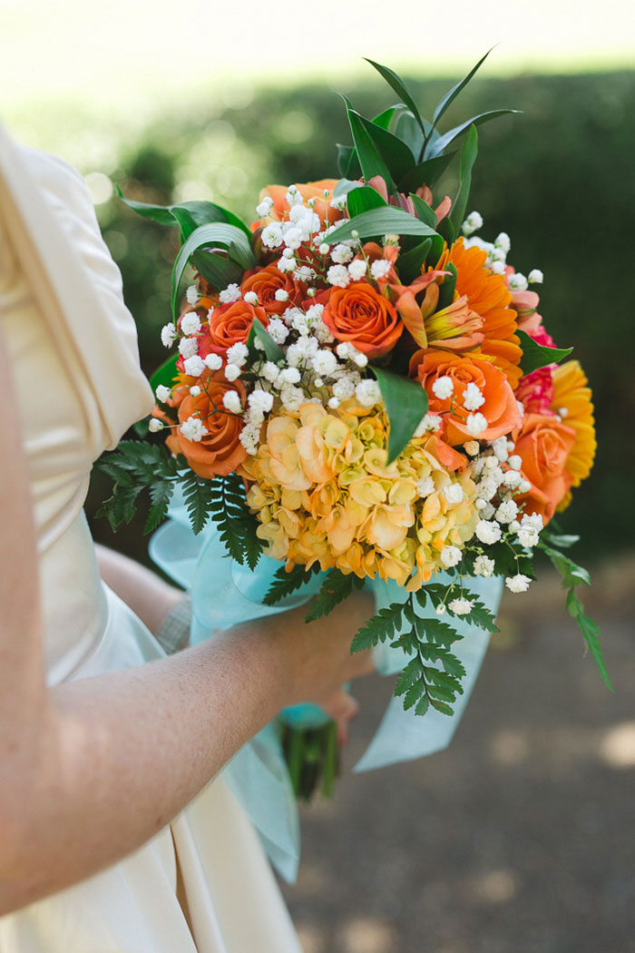 bride's orange and yellow bouquet