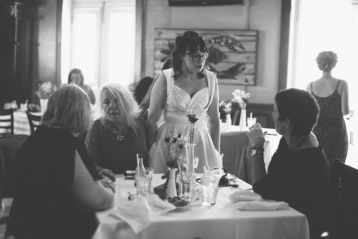 bride talking to guests at reception