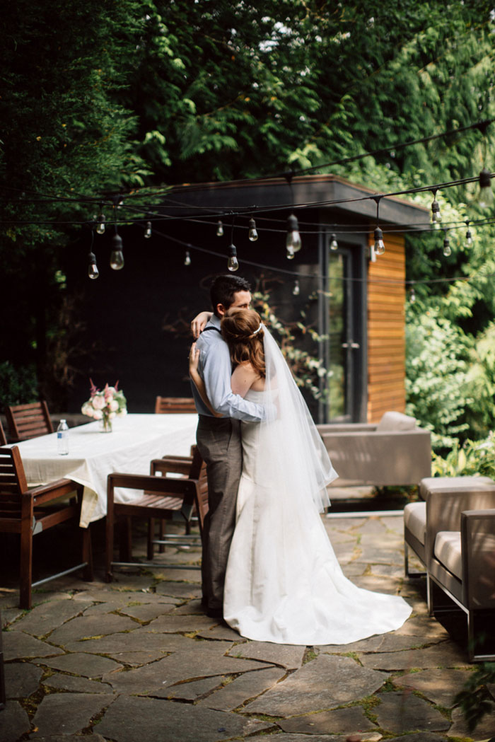 bride and groom hugging