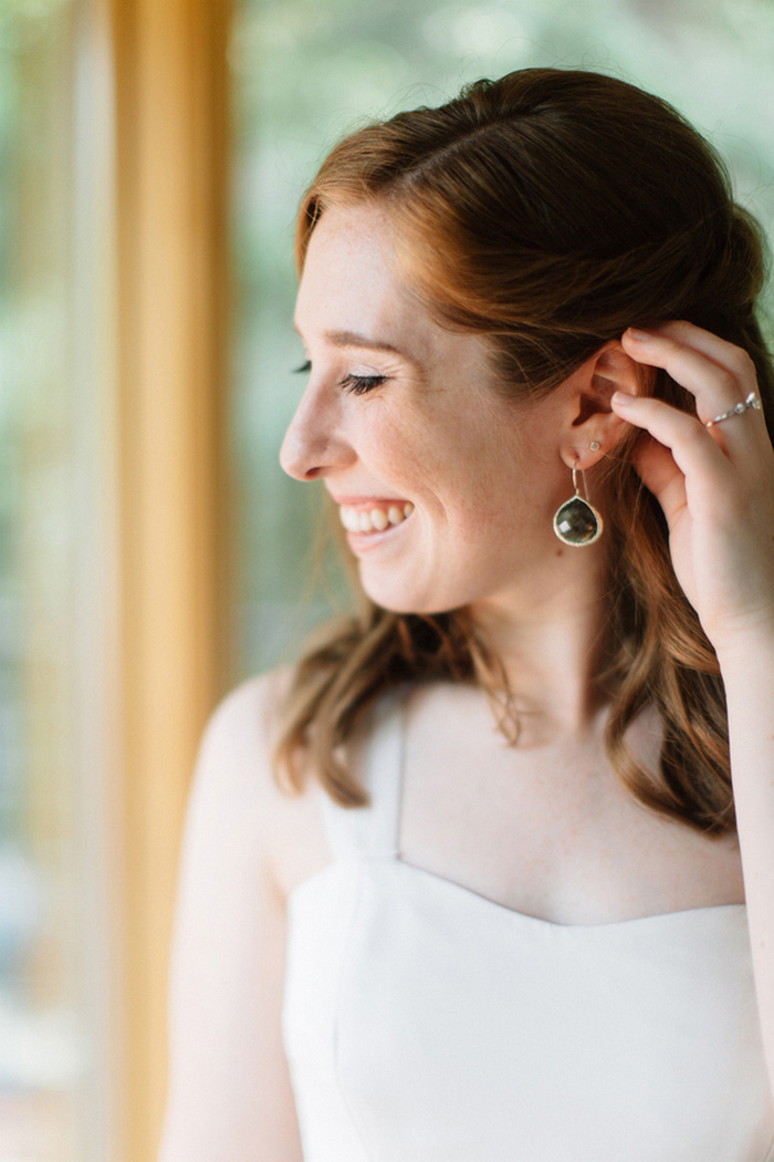 bride showing off earring