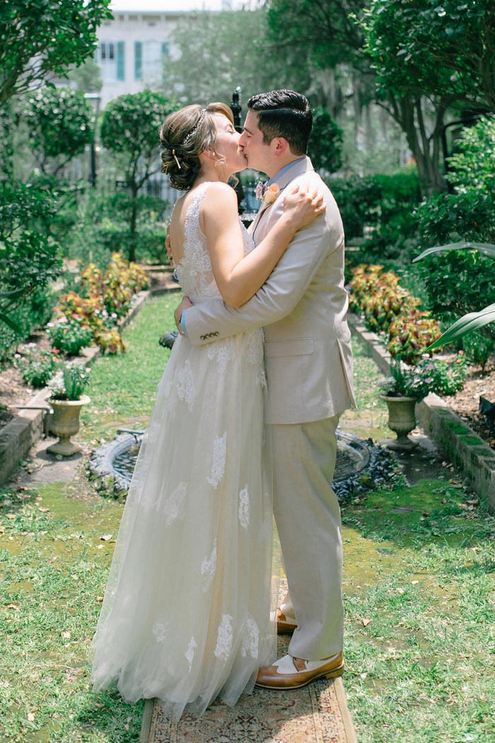 bride and groom first kiss