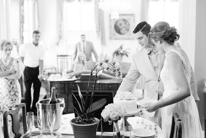 bride and groom cutting the cake