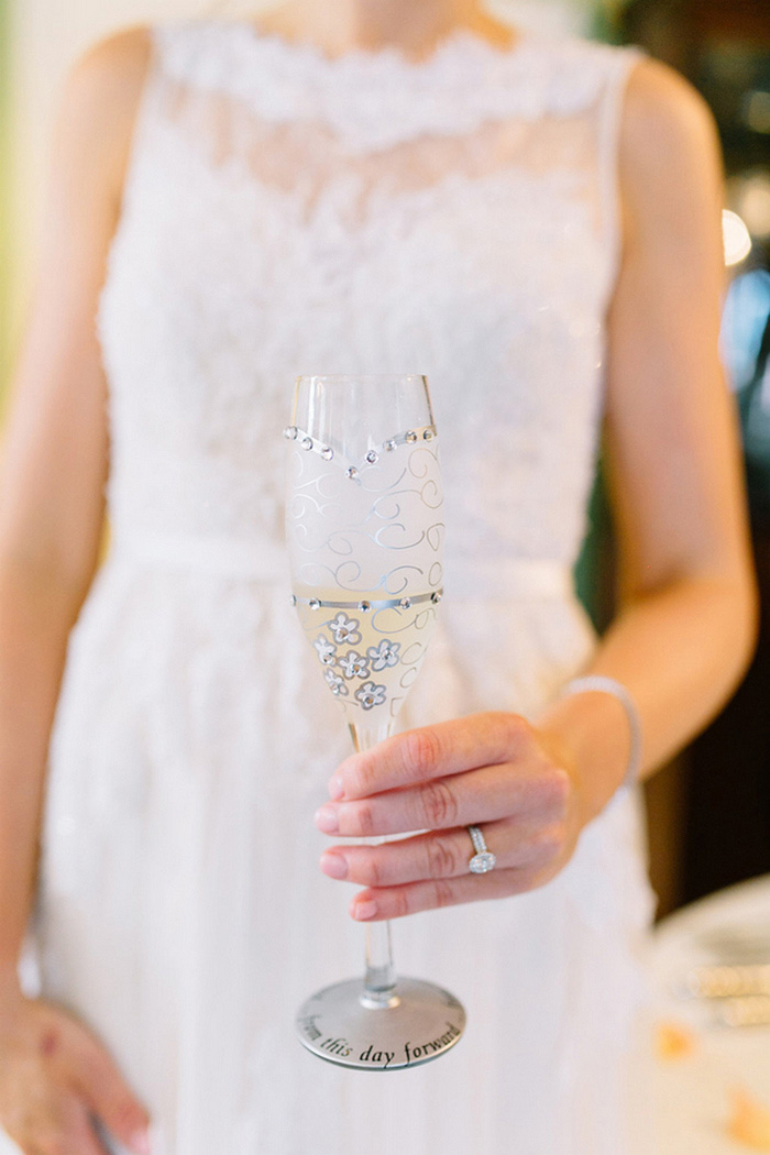 bride holding custom champagne flute