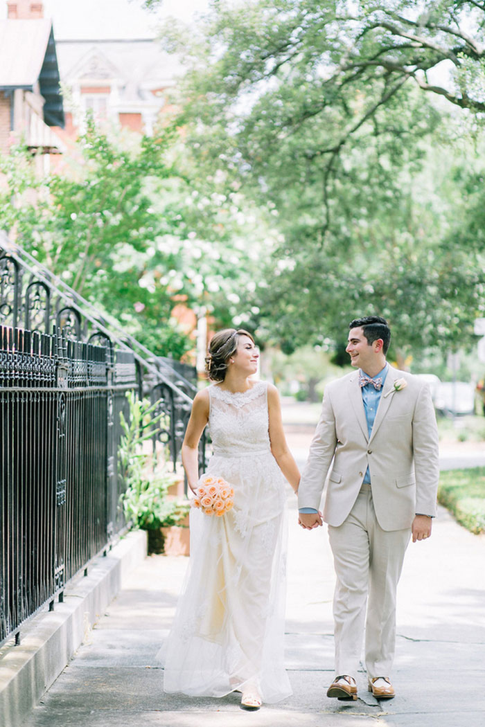 bride and groom walking down Savannah street