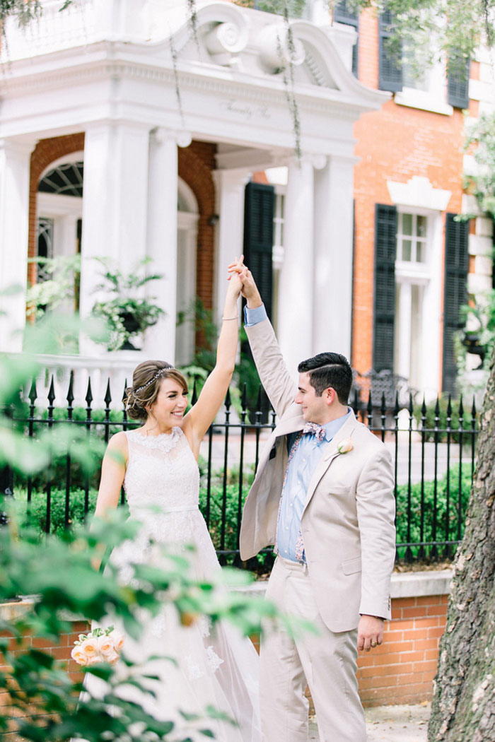 bride and groom holding hands