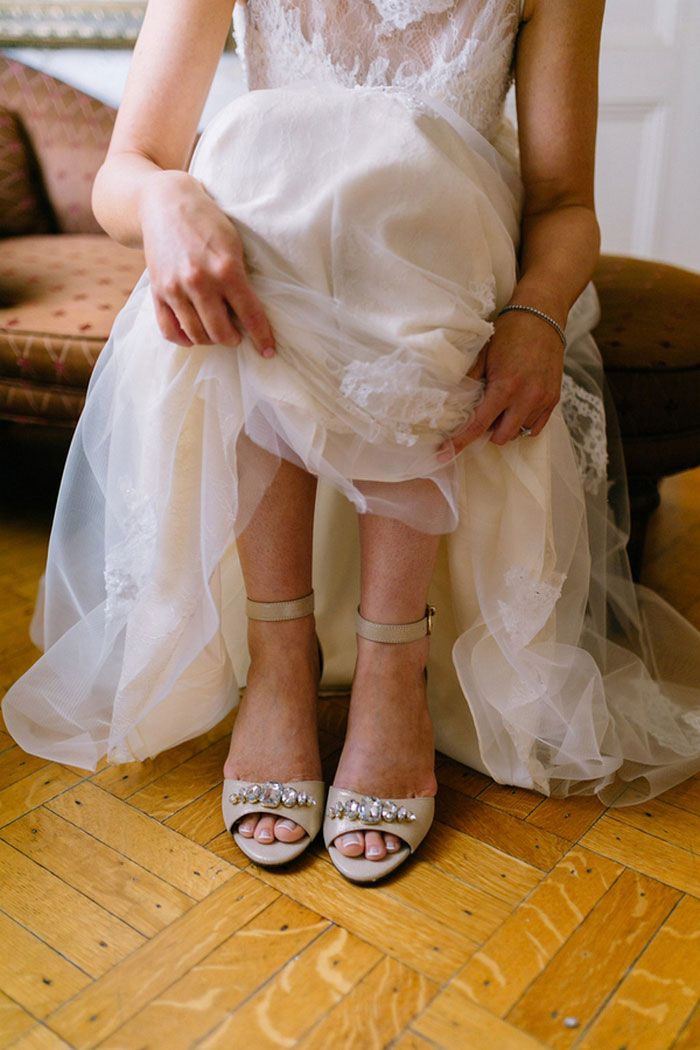 bride putting on shoes