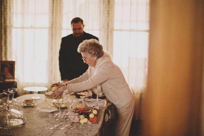 grandmother setting up dining room