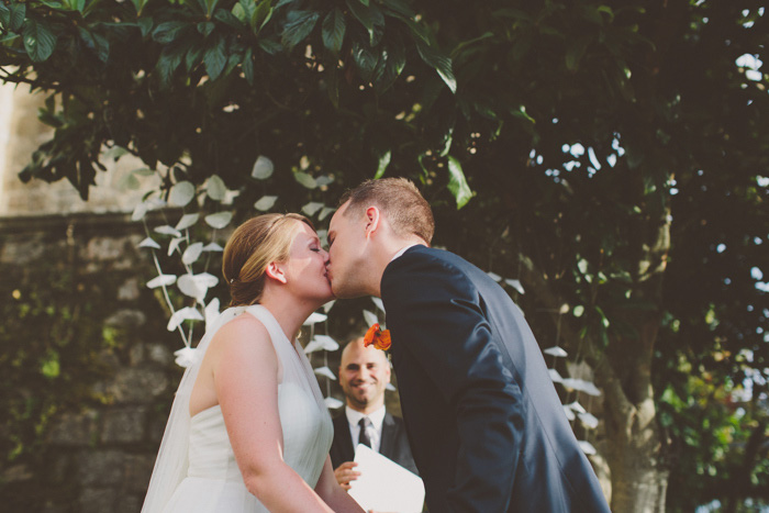 bride and groom first kiss