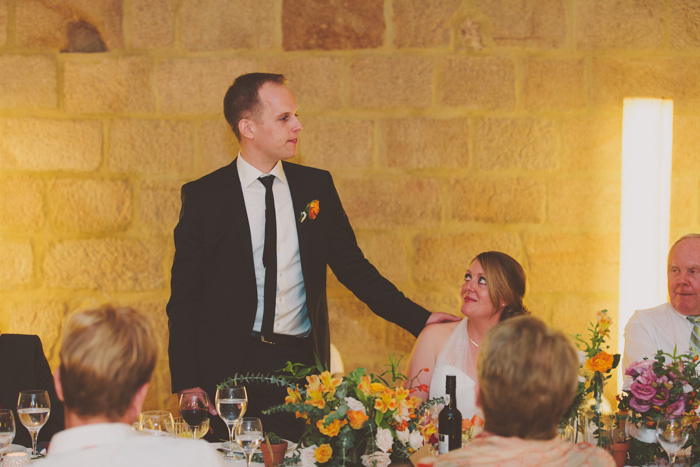 groom speaking at wedding reception