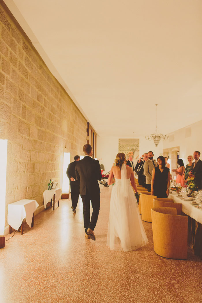 bride and groom entering reception