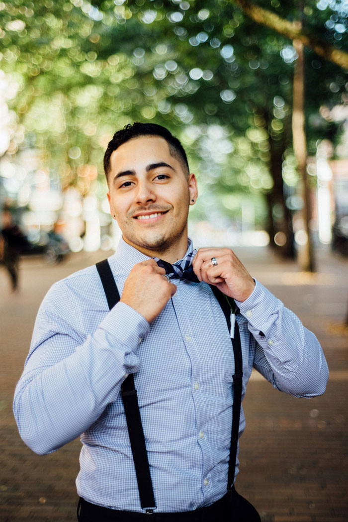 groom adjusting bow tie