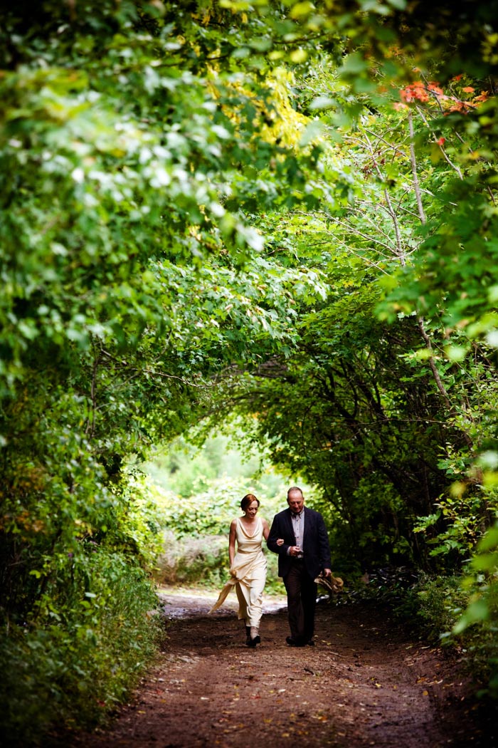 bride walking with father to ceremony