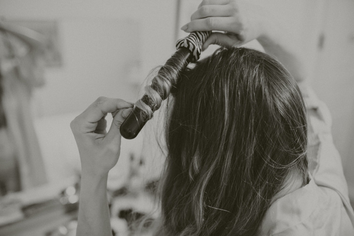 bride curling her hair