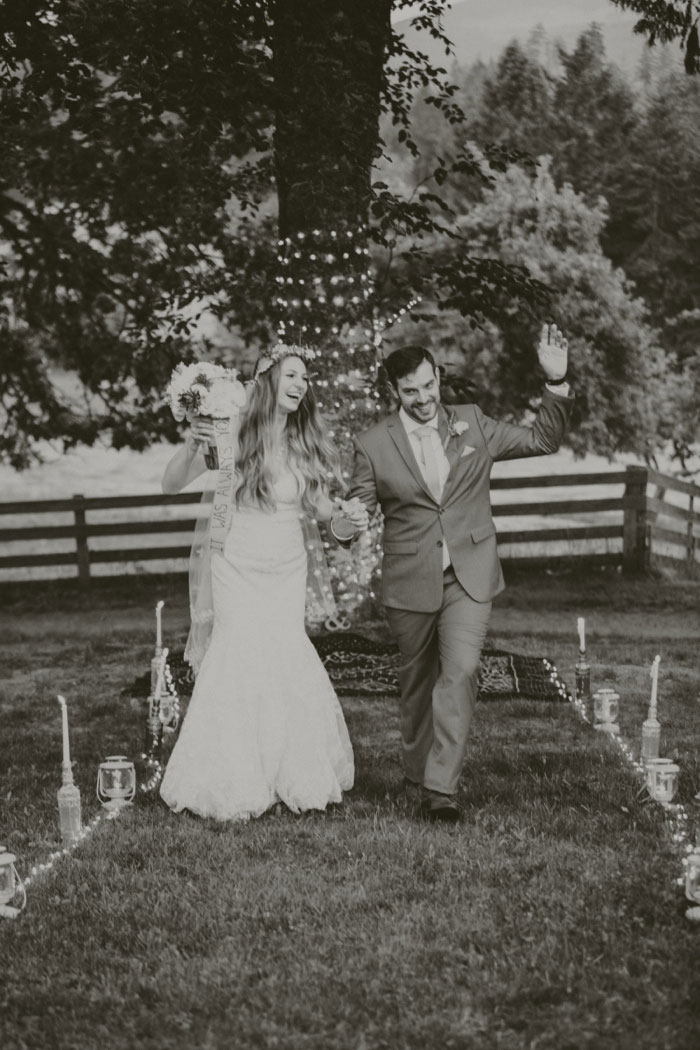 bride and groom walking up aisle as husband and wife