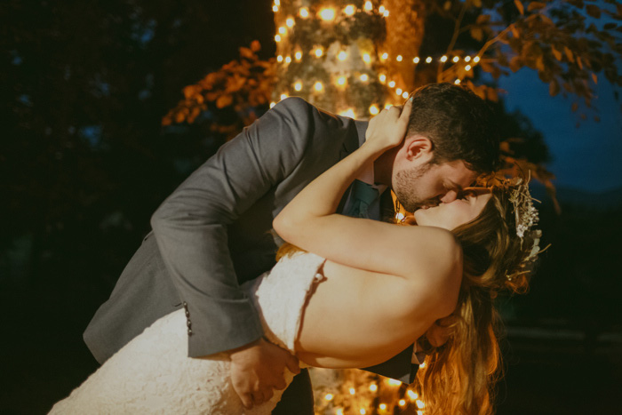 groom dipping bride and kissing her