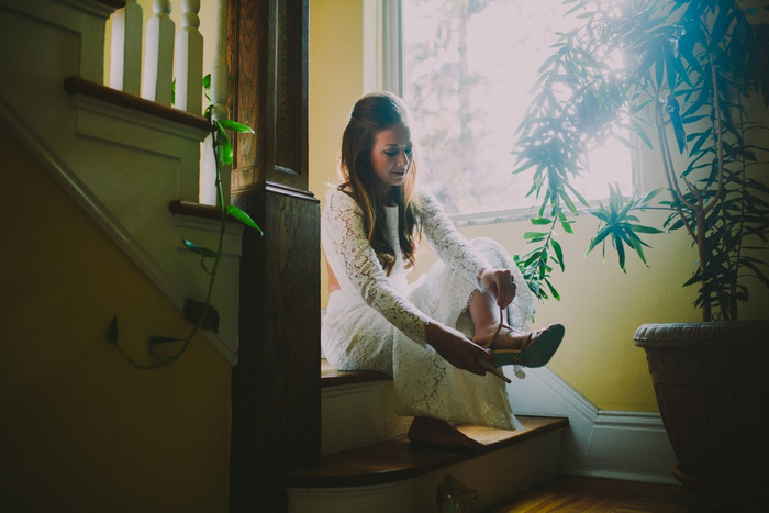 bride putting on shoes