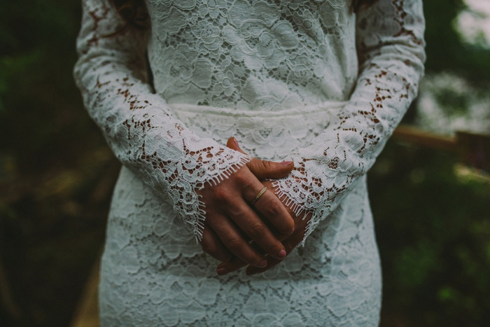 bride with hands clasped in front of her