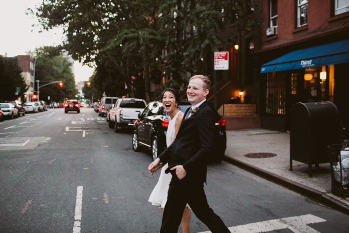 bride and groom crossing the street