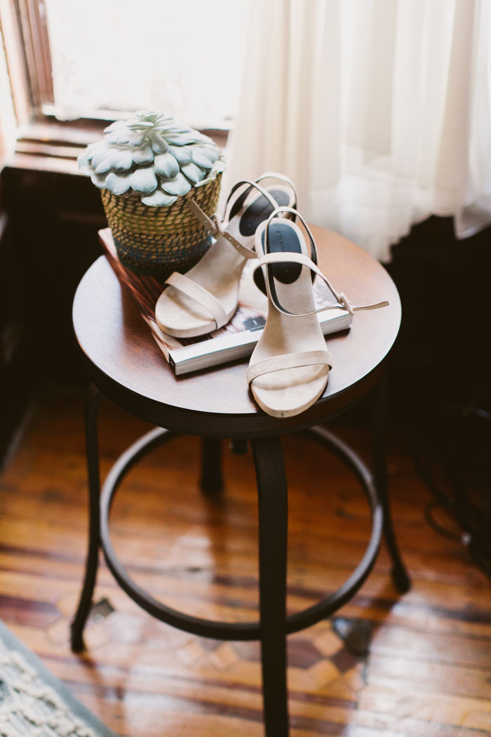 bride's shoes on end table