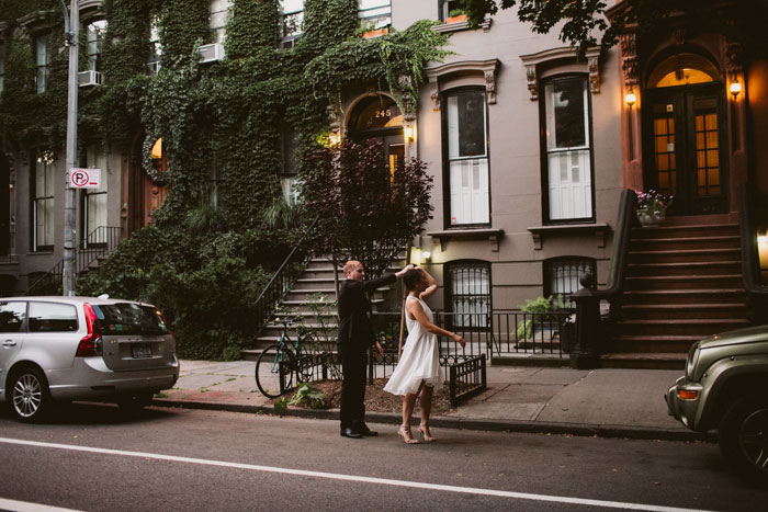 bride and groom dancing on brooklyn sidewalk