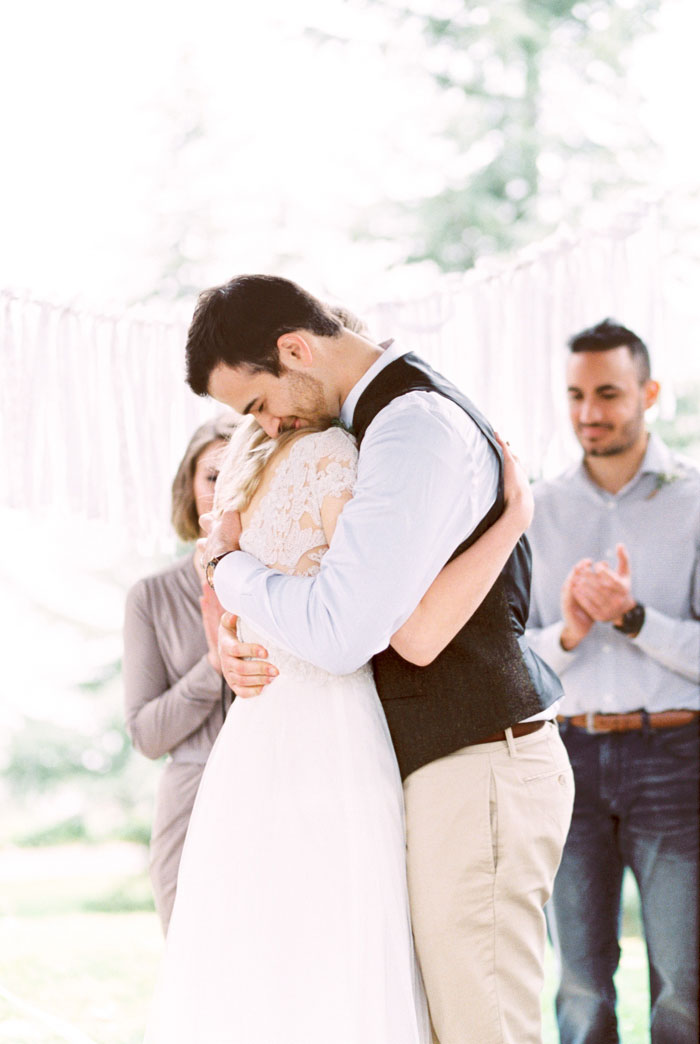 bride and groom hugging during ceremony