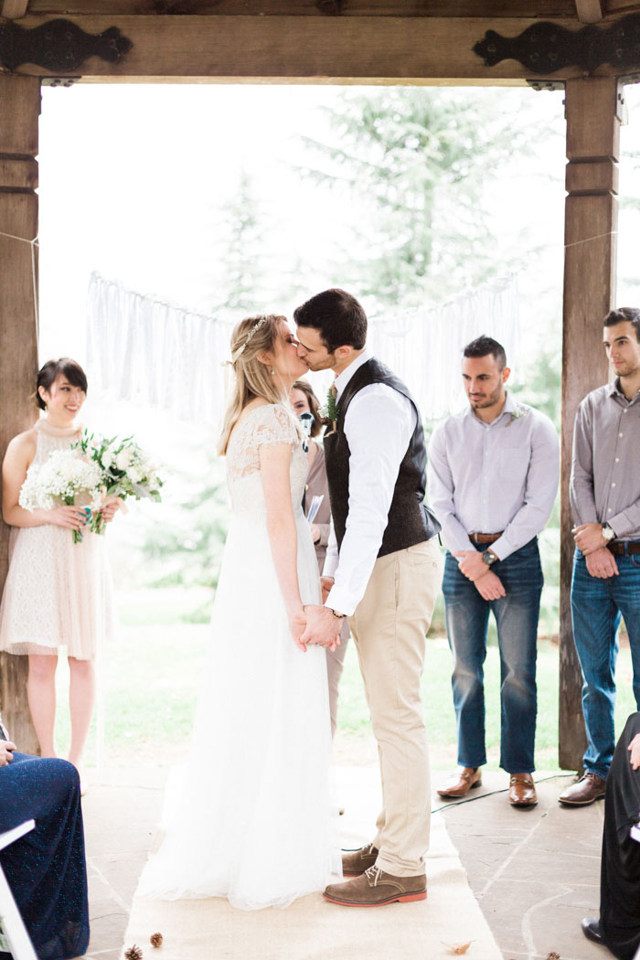 bride and groom first kiss