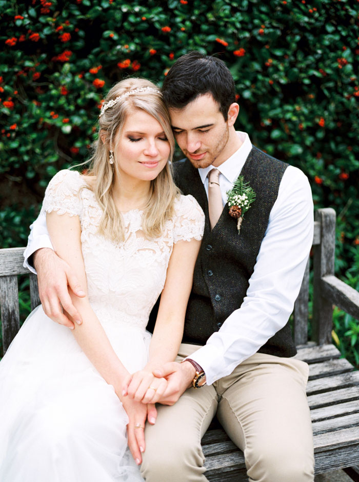 bride and groom portrait on bench