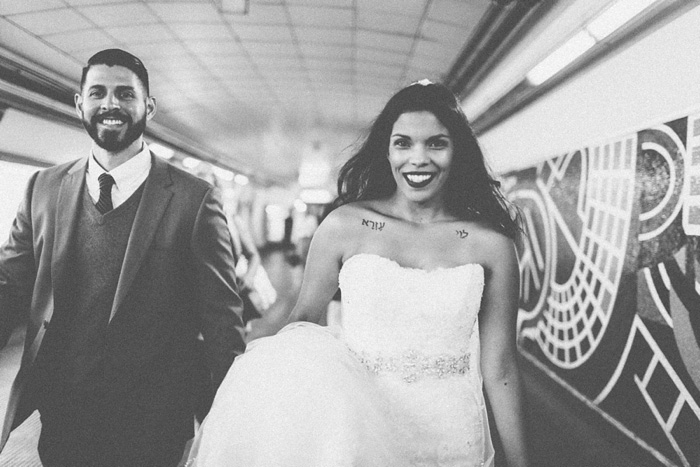 bride and groom in subway station