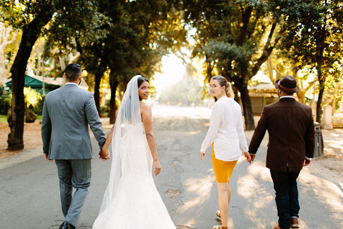 bridal party walking down country road