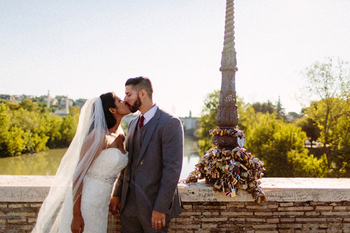 bride and groom kissing at outdoor elopement ceremony in Rome