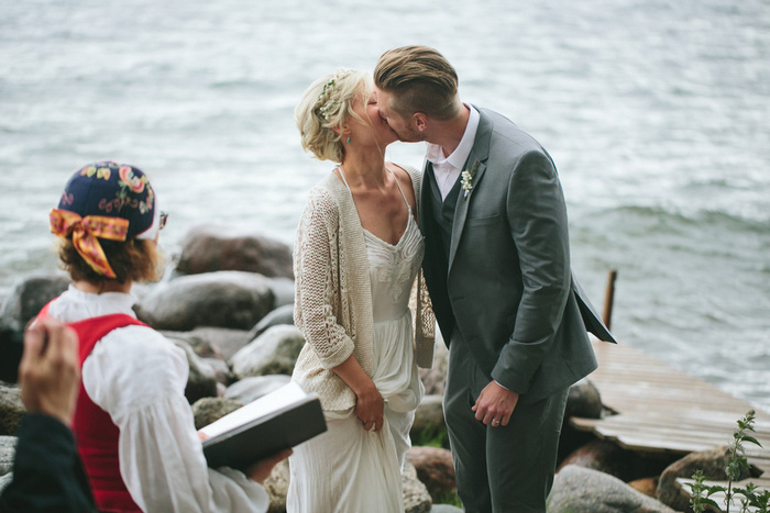 bride and groom first kiss