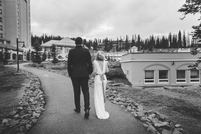 bride and groom walking back to hotel