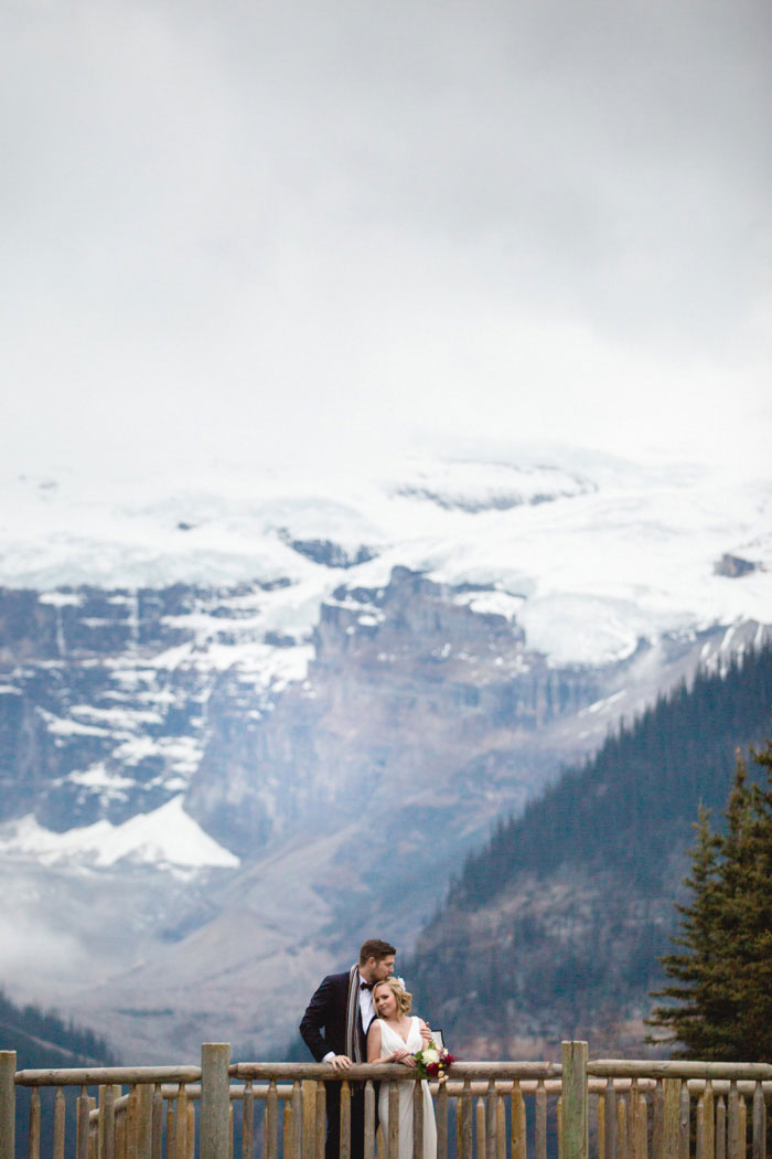 bride and groom portrait in front of mountains