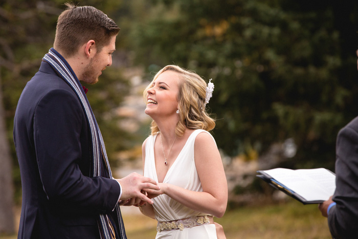 bride laughing during elopement ceremony