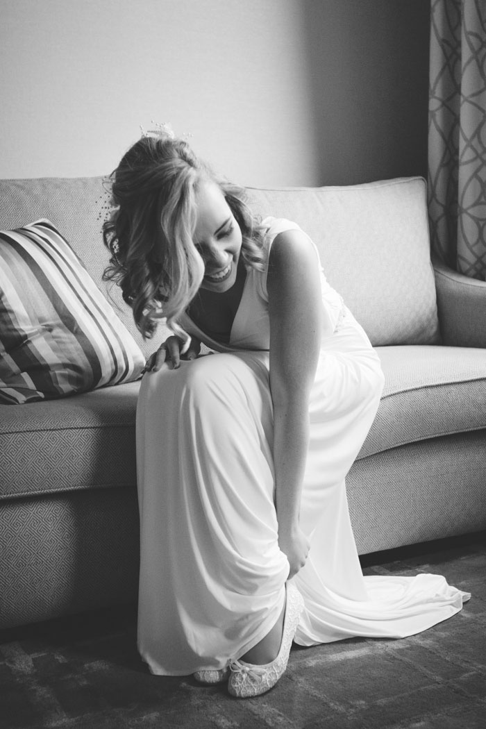 bride putting on her shoes