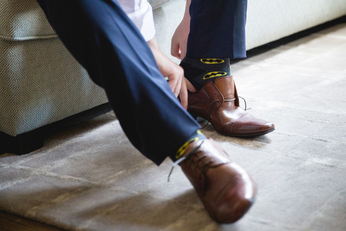 groom putting on shoes