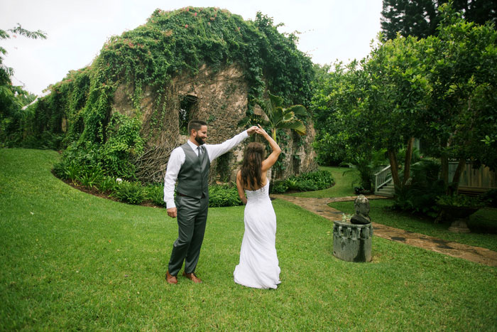 bride and groom dancing outside