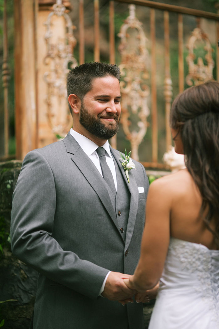 groom looking at bride during ceremony