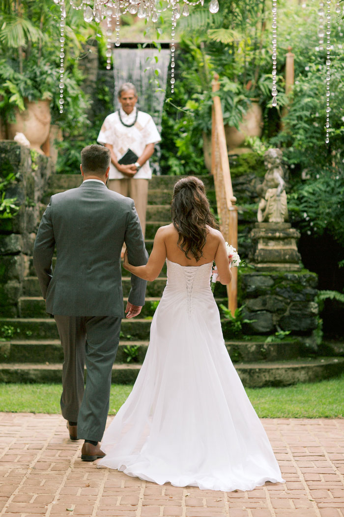 bride and groom walking up aisle